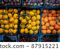 Fresh tangerines, strawberries and figs on the counter 87915221