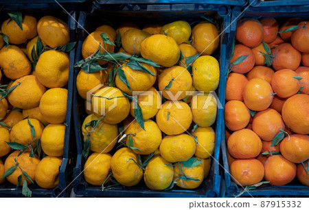 Fresh tangerines on the counter 87915332