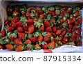 Fresh strawberries on the store counter 87915334