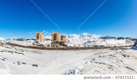 Greenlandic landscape with Inuit multistory houses of Nuuk city on the rocks, Greenland 87915525