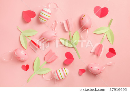 Colorful easter eggs and paper decor background. Painted Easter eggs, top view. Banner for your site, greeting card, flyer, invitation. Tender paper decoation for party 87916693