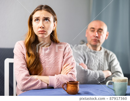 Sad woman having quarrel with her husband Sad woman having quarrel with her husband 87917360