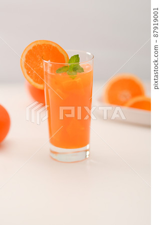 Fresh orange juice on a white table 87919001
