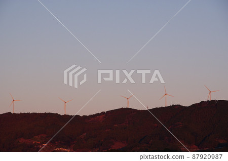 Wind farm on the sunrise and mountains Wind farm on the sunrise and mountains 87920987