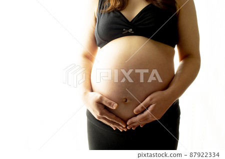 Pregnant woman stomach 87922334