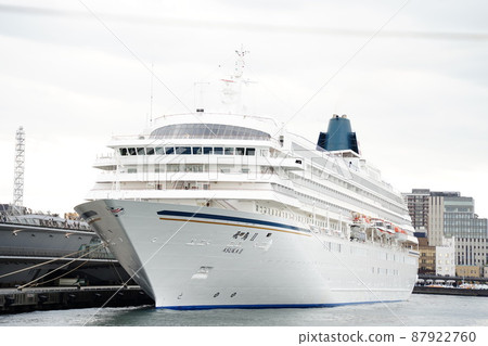 Exterior view of Asuka 2 luxury cruise liner anchored at Osanbashi International Passenger Ship Terminal (Meriken Wharf) in Yokohama Port Exterior view of Asuka 2 luxury cruise liner anchored at Osanbashi International Passenger Ship Terminal (Meriken Wharf) in Yokohama Port 87922760