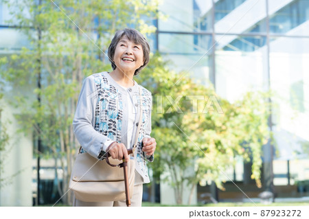 Portrait of a senior woman walking with a cane Shooting cooperation "LINK FOREST" Portrait of a senior woman walking with a cane Shooting cooperation "LINK FOREST" 87923272