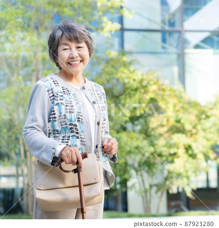 Portrait of a senior woman walking with a cane Square shooting cooperation "LINK FOREST" Portrait of a senior woman walking with a cane Square shooting cooperation "LINK FOREST" 87923280