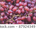 Bunch of colorful grapes with leaves 87924349