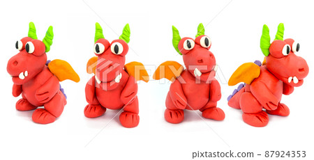 Play plasticine Dragon on white background. Handmade clay plasticine 87924353