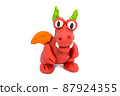 Play plasticine Dragon on white background. Handmade clay plasticine 87924355