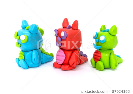 Play plasticine Dragon on white background. Handmade clay plasticine Play plasticine Dragon on white background. Handmade clay plasticine 87924363