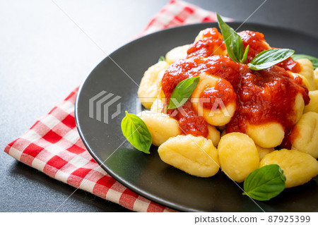 gnocchi in tomato sauce with cheese gnocchi in tomato sauce with cheese 87925399