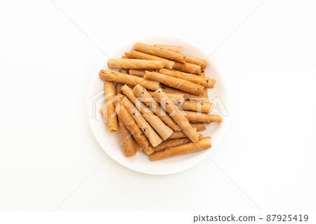 crispy coconut roll on plate crispy coconut roll on plate 87925419
