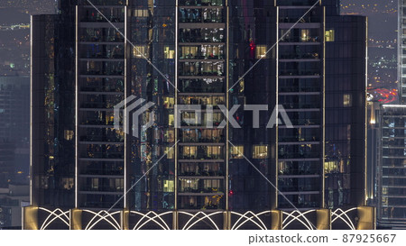 Windows in apartments of a high class building at night timelapse Windows in apartments of a high class building at night timelapse 87925667