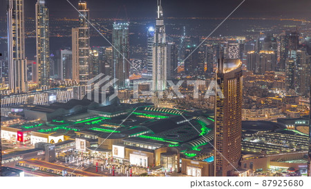 Aerial view of tallest towers in Dubai Downtown skyline and highway night timelapse. Aerial view of tallest towers in Dubai Downtown skyline and highway night timelapse. 87925680