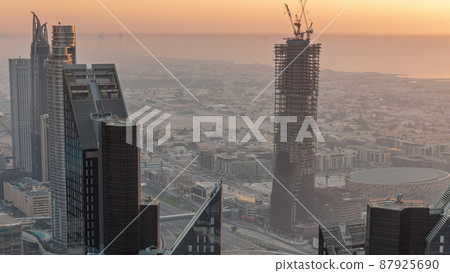 Downtown skyline with modern architecture form above timelapse. Aerial view of Dubai business bay towers. Downtown skyline with modern architecture form above timelapse. Aerial view of Dubai business bay towers. 87925690