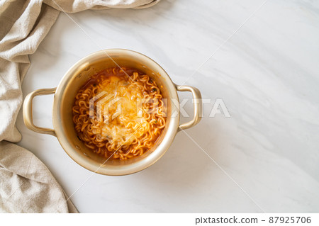 Korean spicy instant noodle with cheese 87925706