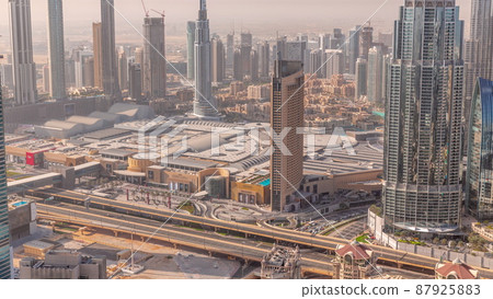Aerial view of tallest towers in Dubai Downtown skyline and highway timelapse. Aerial view of tallest towers in Dubai Downtown skyline and highway timelapse. 87925883