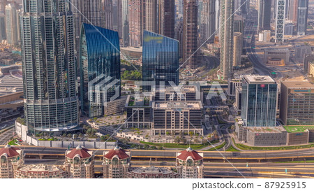 Aerial view of tallest towers in Dubai Downtown skyline and highway timelapse. Aerial view of tallest towers in Dubai Downtown skyline and highway timelapse. 87925915
