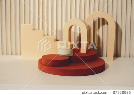 Abstract composition with cosmetic skincare product in glass bottles standing on round podium against texture beige background, copy space for text. Abstract composition with cosmetic skincare product in glass bottles standing on round podium against texture beige background, copy space for text. 87928986