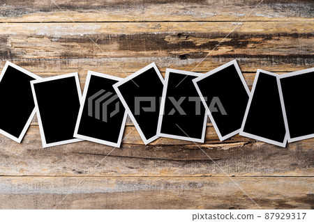 Blank photo frames for your photos on wooden background Blank photo frames for your photos on wooden background 87929317