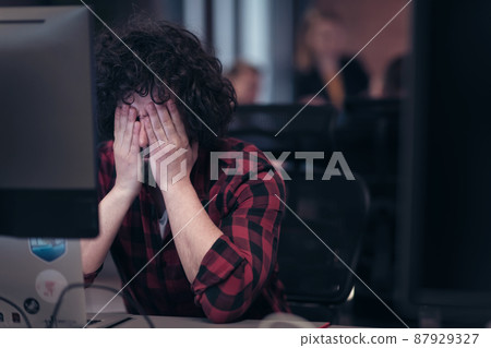 Disappointed businessman wearing headset having virtual team meeting group call chatting with diverse people in customer support. Video conference call on computer with manager and employees. 87929327