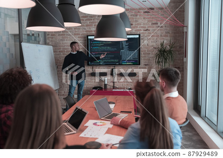 Leader give a business presentation at an office conference meeting, businessman coach mentor explains graph chart on board corporate group workshop training in boardroom. Selective focus  87929489