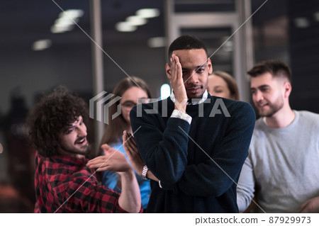 A group of young business people have fun playing interesting games while taking a break from work in a modern office. Selective focus  87929973