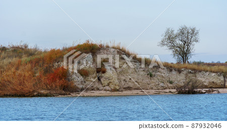 seascape, stone and waves, wild landscape of late autumn, cloudy weather seascape, stone and waves, wild landscape of late autumn, cloudy weather 87932046