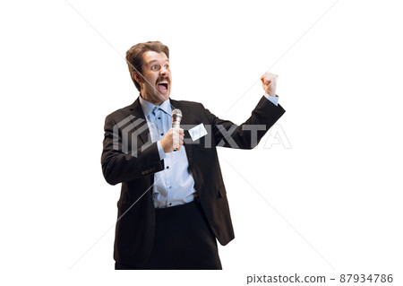 Emotive young man, professional sport commentator, journalist with microphone broadcasting football match isolated over white background. Sport, news concept Emotive young man, professional sport commentator, journalist with microphone broadcasting football match isolated over white background. Sport, news concept 87934786