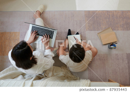 Boy Drawing Picture in Album Boy Drawing Picture in Album 87935443