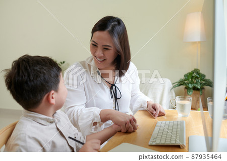 Mother Supporting Little Son 87935464