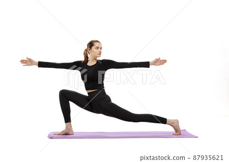 Portrait of young sportive girl doing yoga exercises isolated over white studio background Portrait of young sportive girl doing yoga exercises isolated over white studio background 87935621