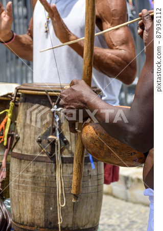 Musicians playing handmade instruments used in capoeira in Salvador, Bahia 87936112