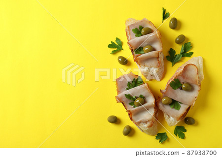 Delicious italian snacks bruschetta on yellow background Delicious italian snacks bruschetta on yellow background 87938700
