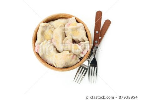 Bowl with pierogi with cherry isolated on white background Bowl with pierogi with cherry isolated on white background 87938954
