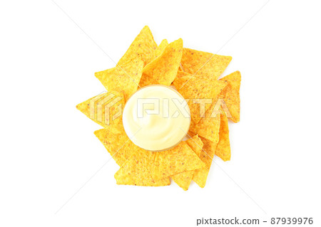 Bowl with cheese sauce and chips isolated on white background 87939976