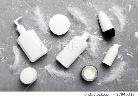 Spa cosmetic product, cream jar, branding mock up, top view with feathers background. Flat lay 87940312