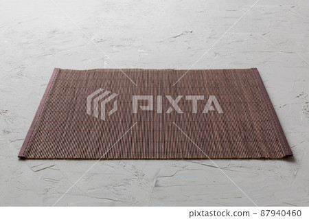 Perspective view of brown tablecloth for food on cement background. Empty space for your design 87940460