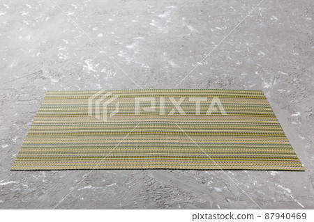 Perspective view of tablecloth for food on cement background. Empty space for your design 87940469