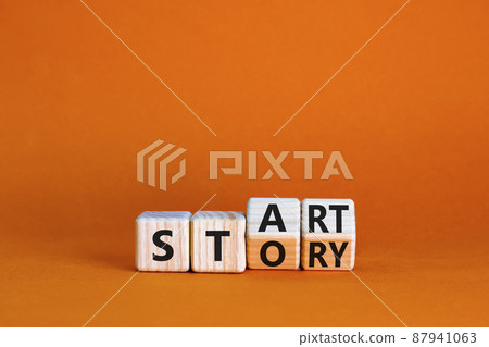 Start your story symbol. Turned wooden cubes and changed the concept word Start to Story. Beautiful orange table orange background, copy space. Business start your story concept. Start your story symbol. Turned wooden cubes and changed the concept word Start to Story. Beautiful orange table orange background, copy space. Business start your story concept. 87941063