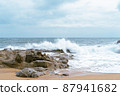 High Tides Coming on to the Rocky Shores of Costa Brava in Spain, cloudy weather 87941682