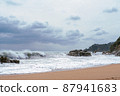 High Tides Coming on to the Rocky Shores of Costa Brava in Spain, cloudy weather 87941683