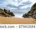High Tides Coming on to the Rocky Shores of Costa Brava in Spain, cloudy weather 87941684