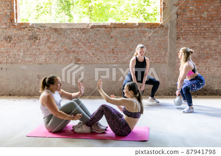 Group of young and attractive sporty caucasian women wearing sports attire and of different body 87941798