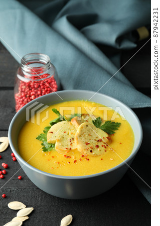 Concept of tasty food with pumpkin soup on wooden table 87942231