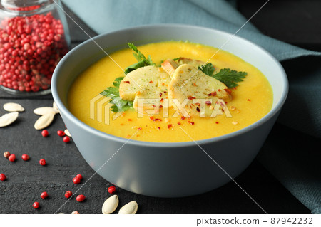 Concept of tasty food with pumpkin soup on wooden table 87942232