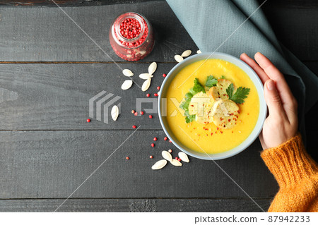 Concept of tasty eating with pumpkin soup on wooden table 87942233