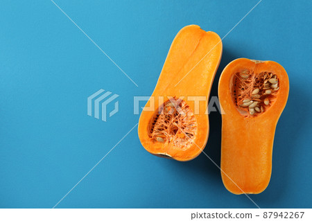 Raw pumpkins on blue background, top view Raw pumpkins on blue background, top view 87942267